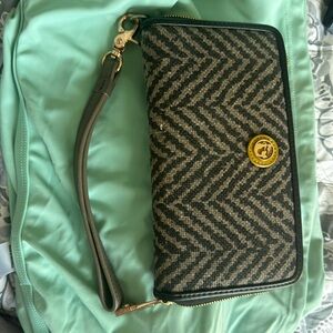 Spartina zip around wallet in or wristlet. Leather and linen. Great shape.